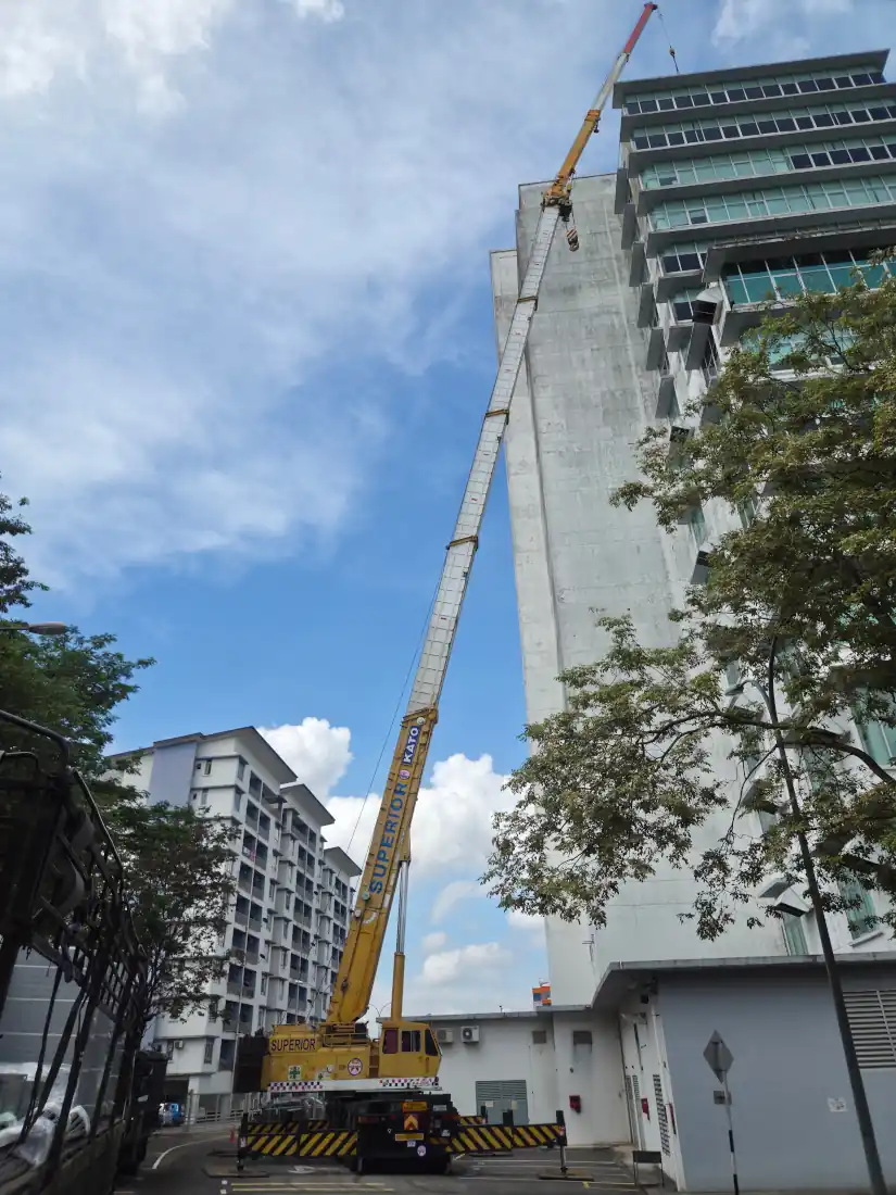Ground crew supervising the rigging of water tank materials before the lift.