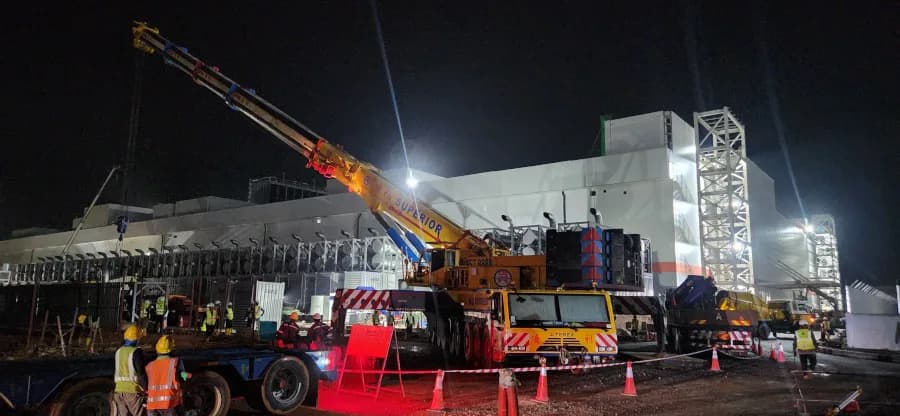 A 700-ton Demag crane lifting a data center module at the Bridge Data Center in Johor.