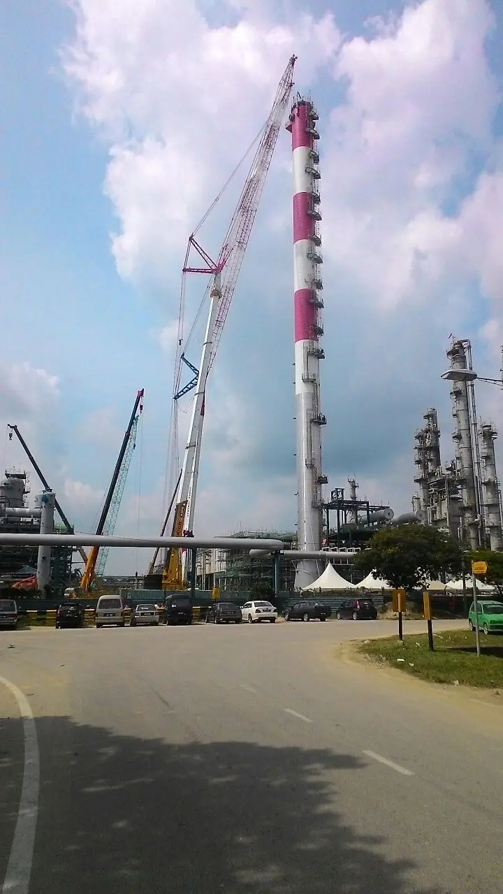 A 200-ton Kato mobile crane with a luffing jib working on the Lotte Chemical flare stack construction in Johor.