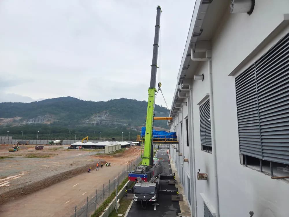 A 300-ton mobile crane lifting a genset at the YTL Green Data Center in Johor.