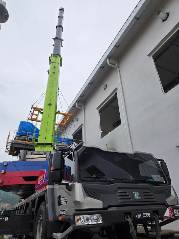 Superior Machinery's expert rigging team preparing the backup generator on the lifting platform in Johor Bahru.